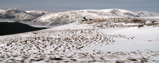 Cairn near the top of Hopetoun Craig with the Moffat Hills beyond