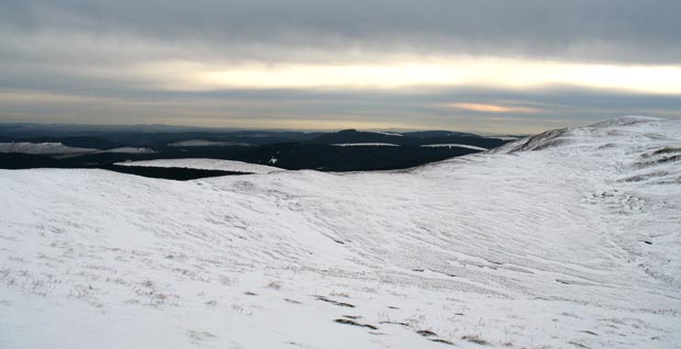 Looking over the saddle between Hopetoun Craig and Ettrick Pen - towards the Solway Firth