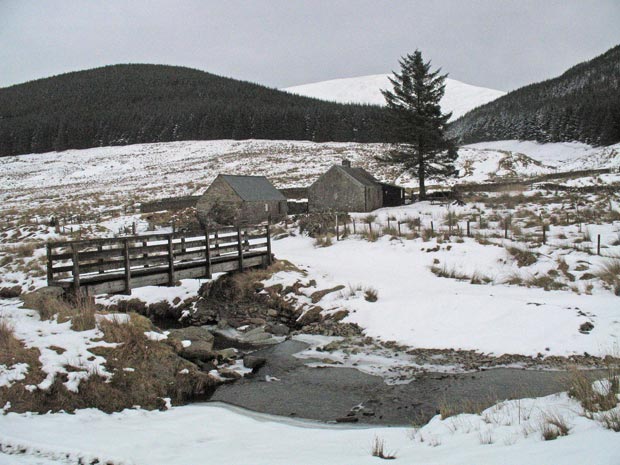 View over Ettrick Water to Over Phawhope bothy with Ettrick Pen in the distance.