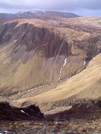 Looking across to Raven Craig from above the waterfalls between Carrifran and Rotten Bottom