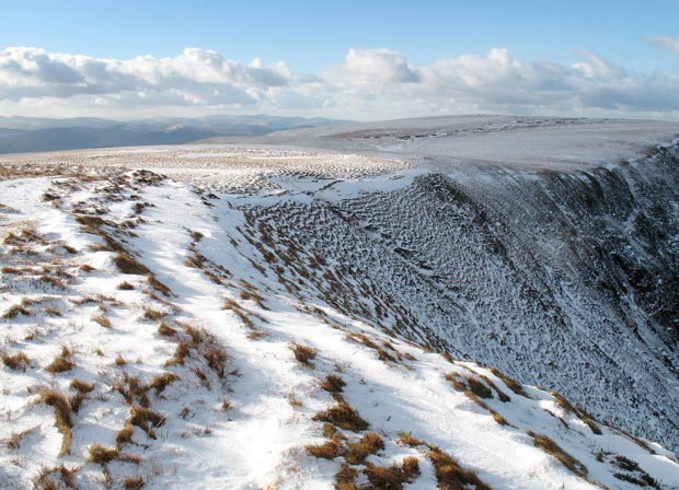 Looking over Nether Coomb Craig to the flat top of Swatte Fell.