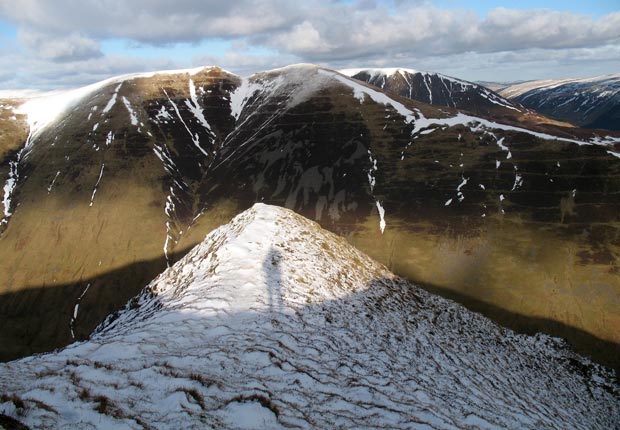 View of Saddle Yoke and Carrifran Gans beyond it from the top of Black Craig.