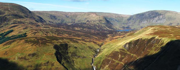 View of Loch Skene and surrounding hills from Andrewhinney Hill in the Ettrick hills.