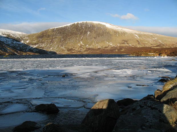 Ice-covered Loch Skene with Lochcraig Head beyond.