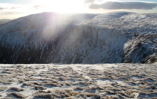 View from the top of Lochcraig Head over Loch Skene to Mid Craig and White Coomb - in a squall