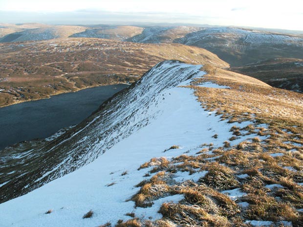 View looking down the nose of Mid Craig and over Loch Skene to the Ettrick Hills