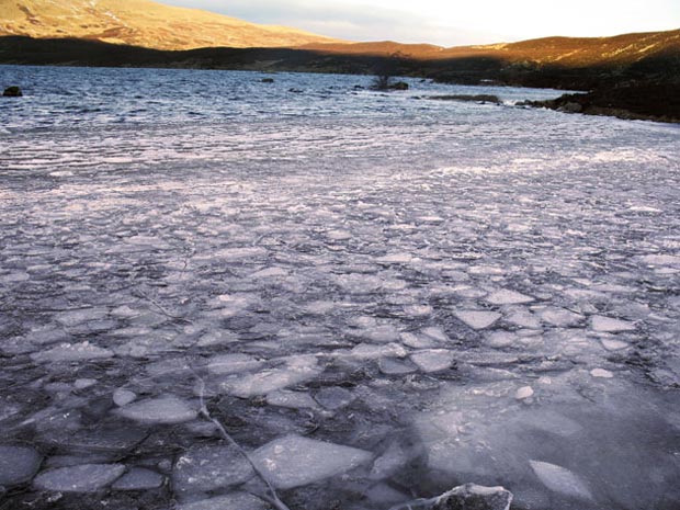 Looking along the the icy surface of Loch Skene towards Lochcraig Head.