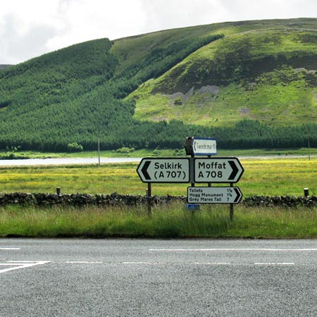 Road signs on the A708 where we join it at Cappercleuch.