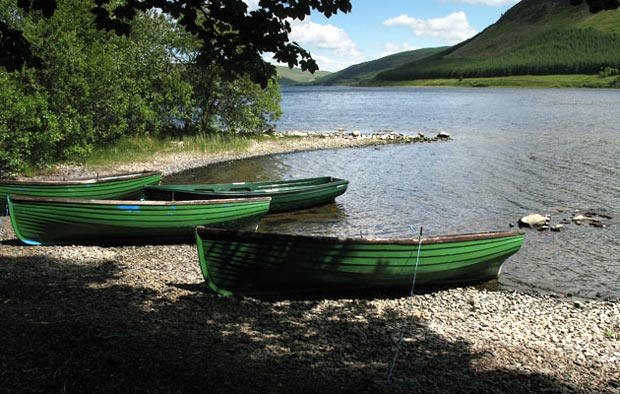 Boats on the shore of St Mary's Loch at Rodono House.