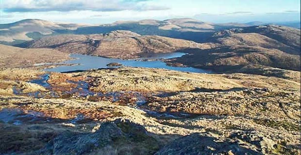 Looking down on Loch Enoch from the top of the Redstone Rig with the Dungeon hills and the Rhinns of Kells behind