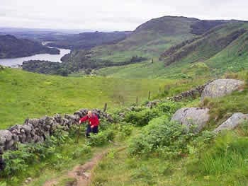 Heading round the shoulder of Buchan Hill  with Loch Trool in the background