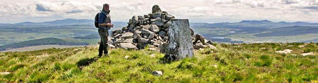 View looking south east from the cairn and trig point at the top of Cairnsmore of Dee.
