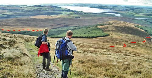 View from above the tree line back over the route already done and out to Wigtown Bay