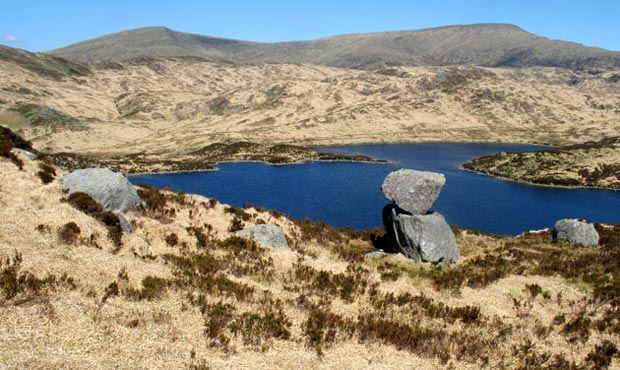 View of boulders on the Rig of the Jarkness with Benyellary and the Merrick beyond