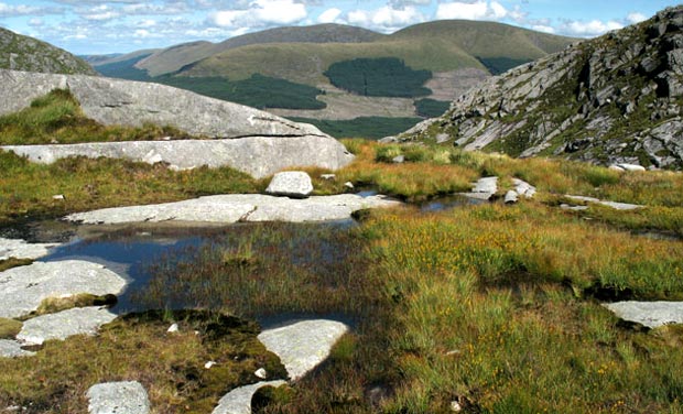 View from the Devil's Bowling Green area across the Nick of the Dungeon to Corserine, Carlin's Cairn and Meaul on the Rhinns of Kells