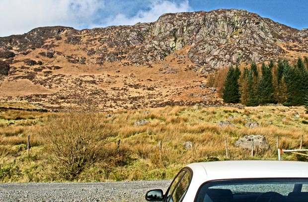 View of the crags on the face of Cairngarroch from car park Craigencallie