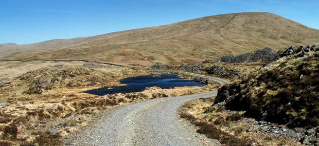 Heading north along the service road  to the mast on Bennan  with Benyellary  ahead.