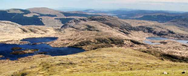 View down Redstone Rig  towards Craig Neldricken, with Lochs Enoch , Arron and Neldricken