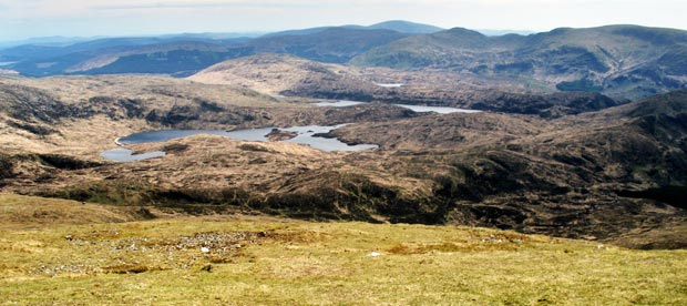 View from the Merrick down Redstone Rig  to Loch Arron,  Loch Neldricken and Loch Valley .