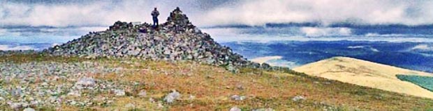 View of the ancient cairn at the top of Carlin's Cairn