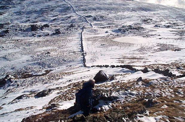 View down into the nick between Meikle Millyea and Milldown with the frozen Lochans of Auchniebut