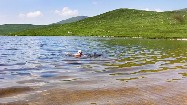 Cooling off in Loch Neldricken with Mullwharchar in the background