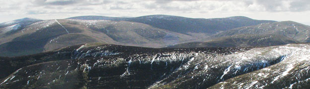 View over a shoulder of Dungrain Law to Stowgill Dod and the Durisdeer Hills