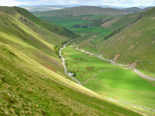 View down the Dalveen Pass from Capel Hill with Dalveen Toll cottage in the foreground