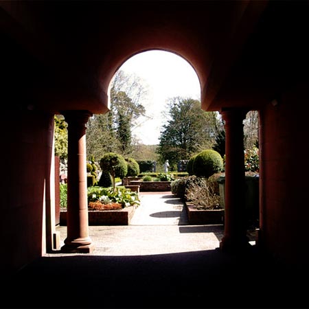 Access to Garries Wood through a pleasant archway and garden off the main street of Gatehouse of Fleet
