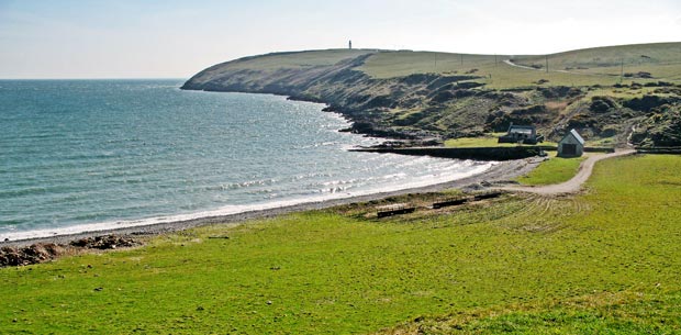 View across the bay at East Tarbet towards the lightnouse on the Mull of Galloway