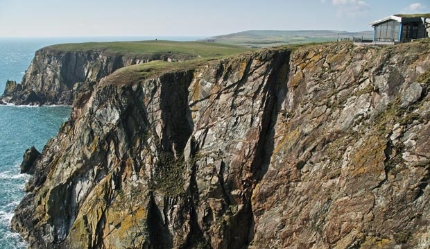 View of the precipitous location of Gallie Craig Coffee House at the Mull of Galloway