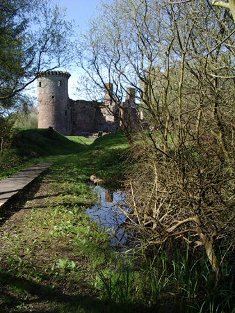 Approaching Caerlaverock Castle from Castle Wood