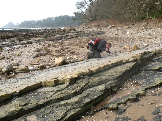 Photographing fossils in the rocks near Arbigland