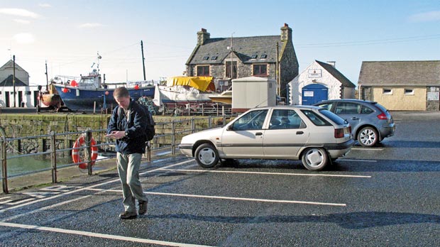 View of parking area around the harbour in Portpatrick