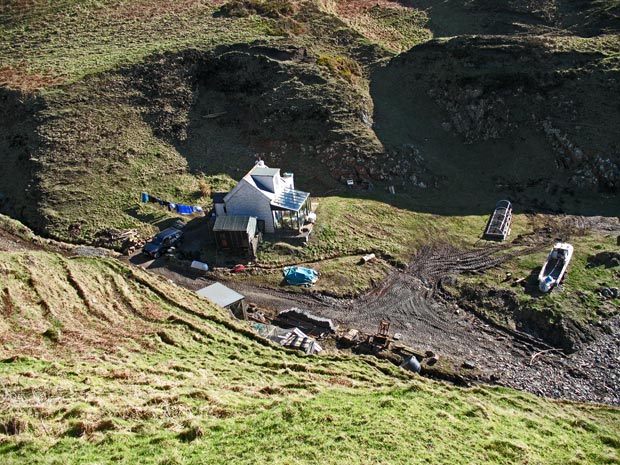 View down into Portamaggie Bay from the cliffs above it