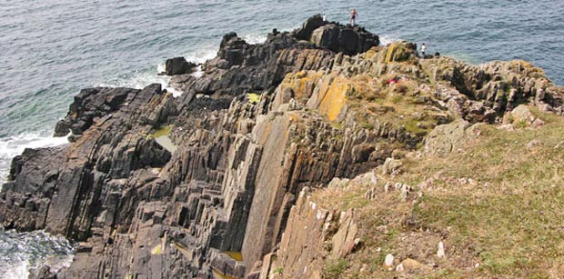 People fishing from the Rock of Providence near Burrow Head