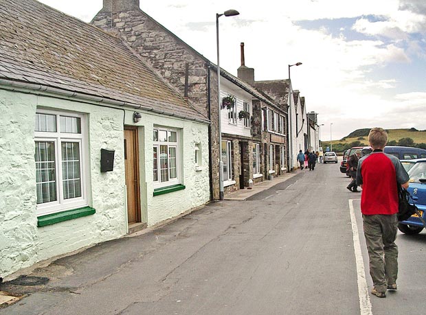 View heading along the waterfront towards the harbour in the Isle of Whithorn