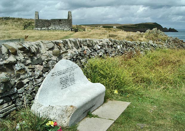 View of St Ninian's Chapel with monument to the crew drowned on the Solway Harvester in foreground