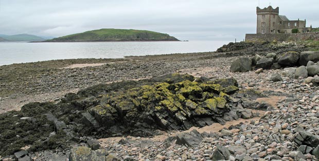 View of tower at Balcary Bay with Hestan Island in the distance.