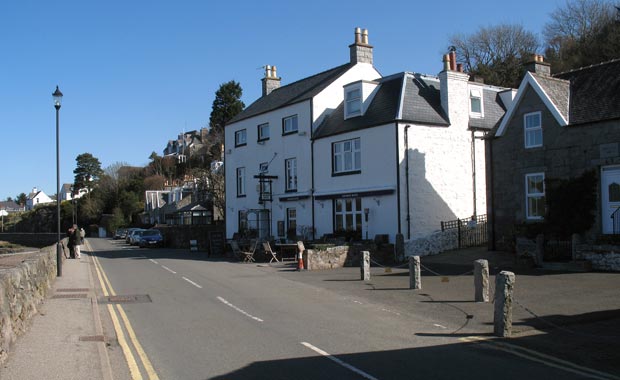 View looking north along the main street in Kippford from besdie the Anchor Hotel.