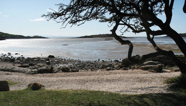 View towards Rough Island from the shingle beach at the end of the shore road Kippford.