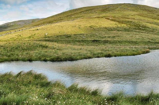 View of the small lochan in the hollow between Dunool and Black Shoulder