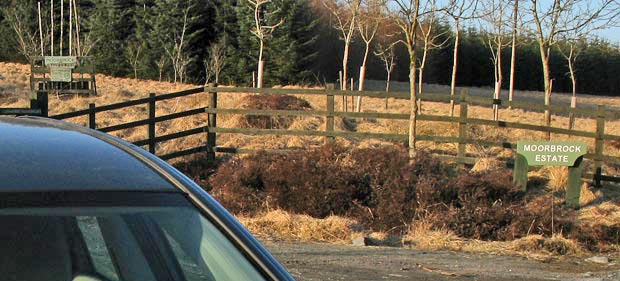 Where the car is parked by the gate into Moorbrock estate